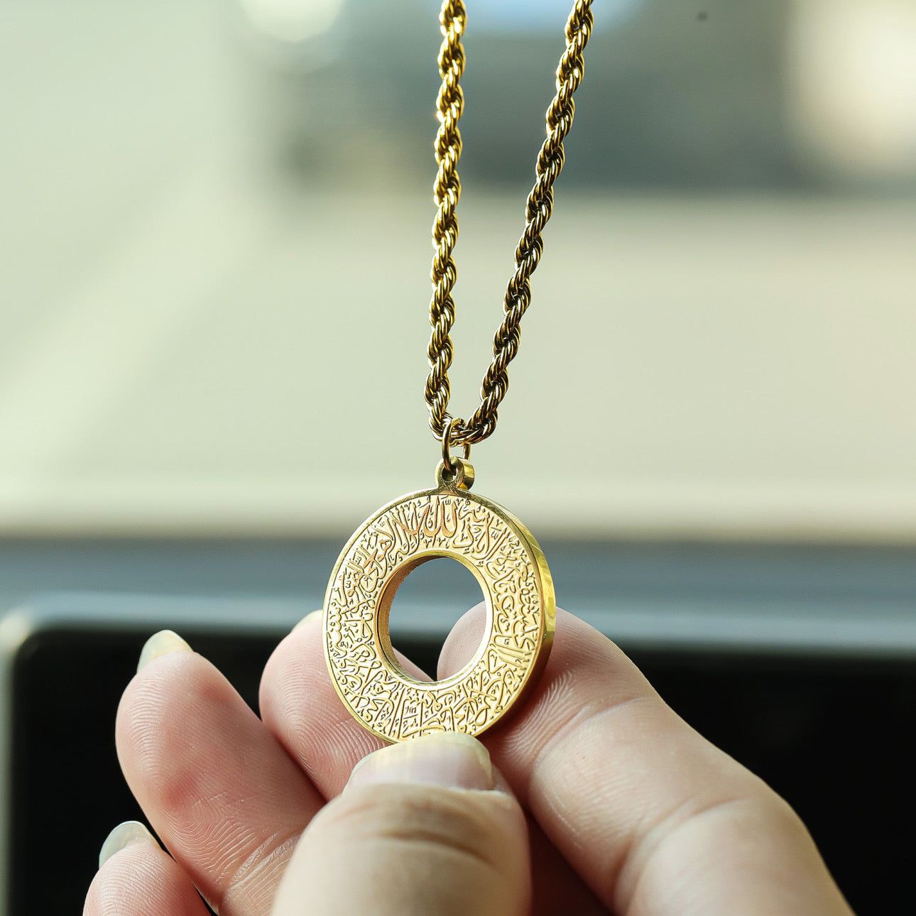 TRENDING HEIGHT gold circular pendant with Arabic engraving on twisted chain held in car dua e safar car hanger