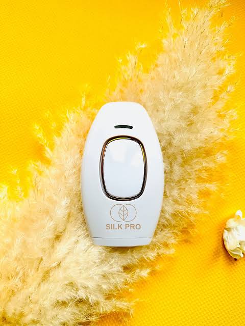 Trending Height Silk Pro handheld device, best laser hair remover for sensitive skin on yellow background